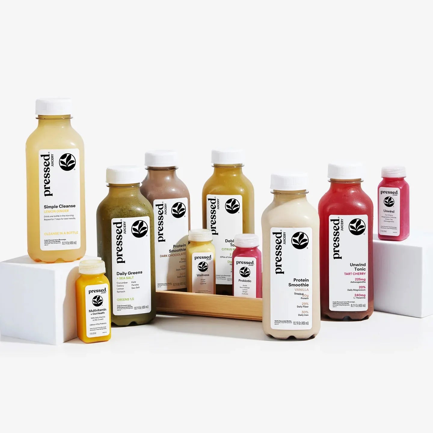 Assorted 'pressed' juice bottles on a white background