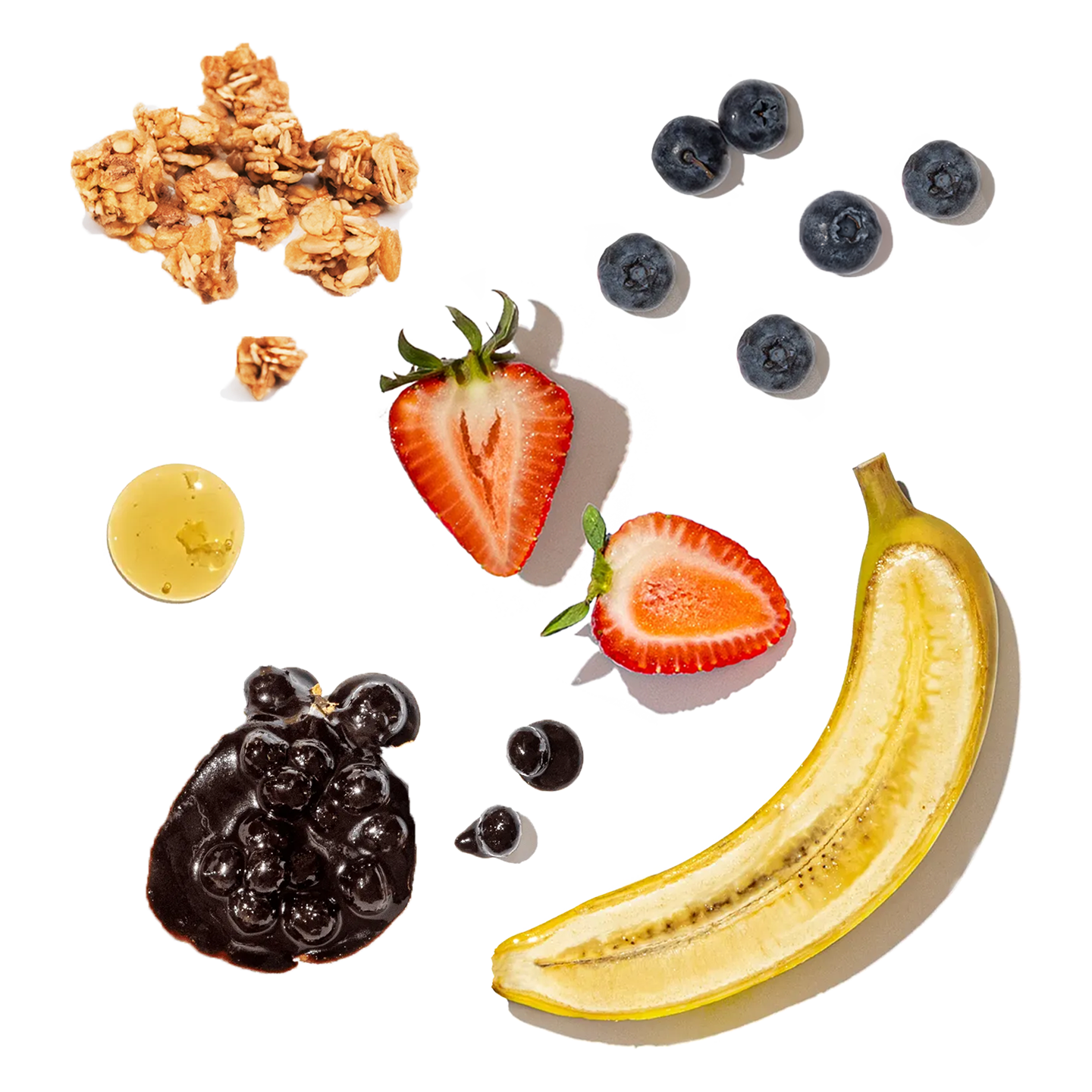 Fruit and granola arrangement on a white background