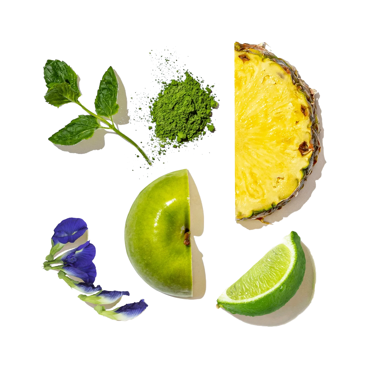Collage of green fruits and vegetables including a pineapple, apple, lime, and mint leaves on a white background.
