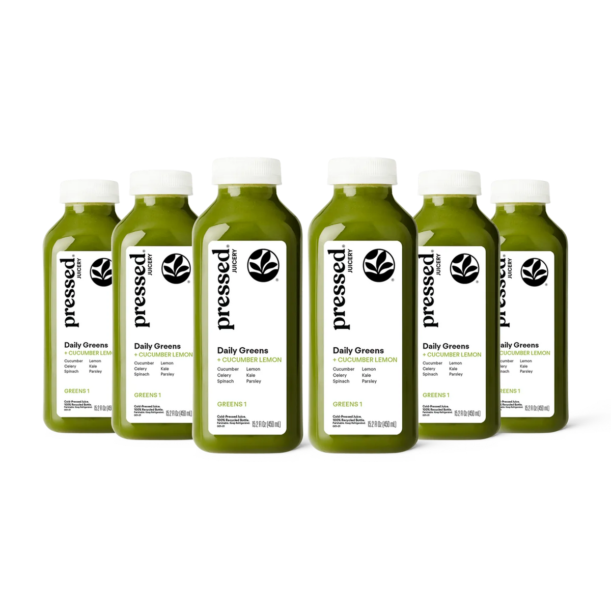 Bottles of pressed Daily Greens juice on a white background