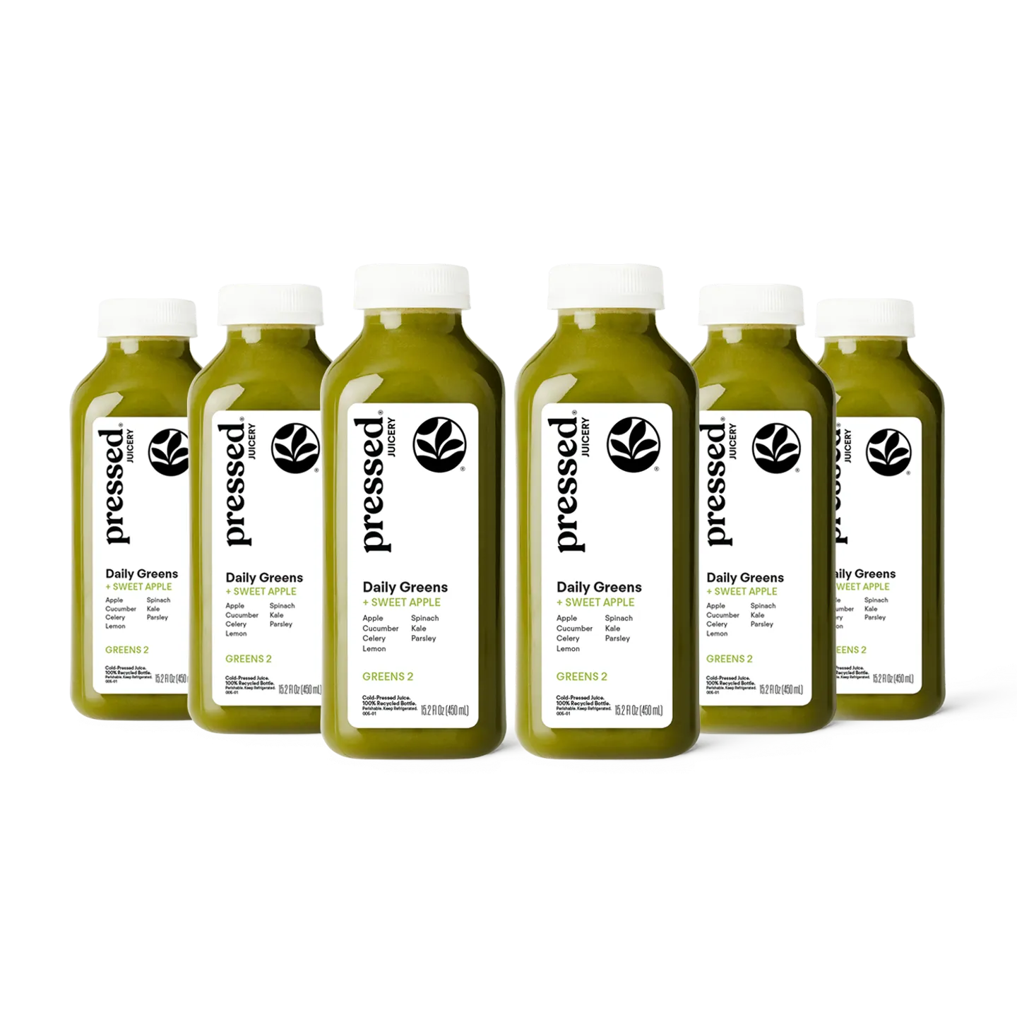 Bottles of 'pressed' Daily Greens juice on a white background