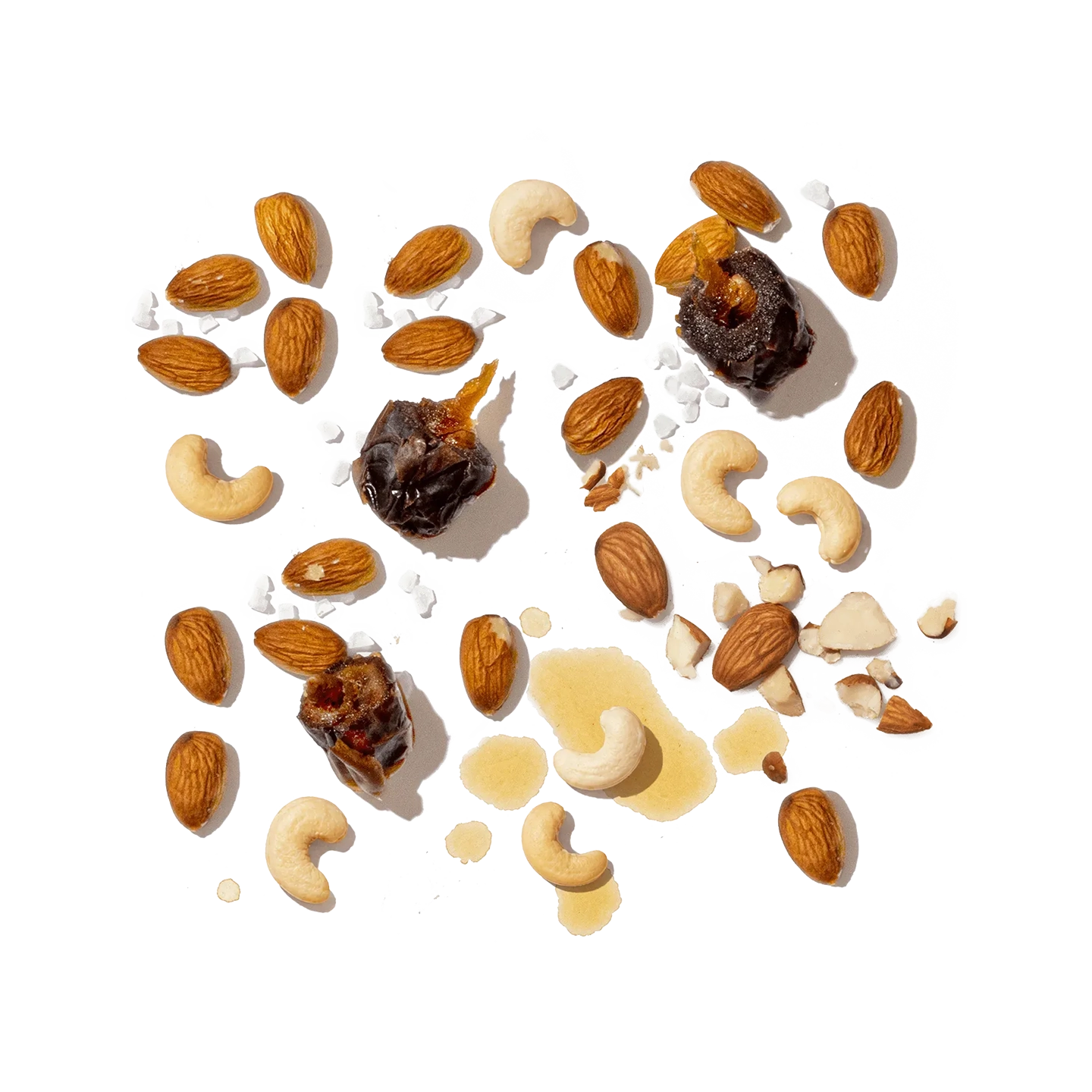 Assorted nuts and dried fruits on a white background