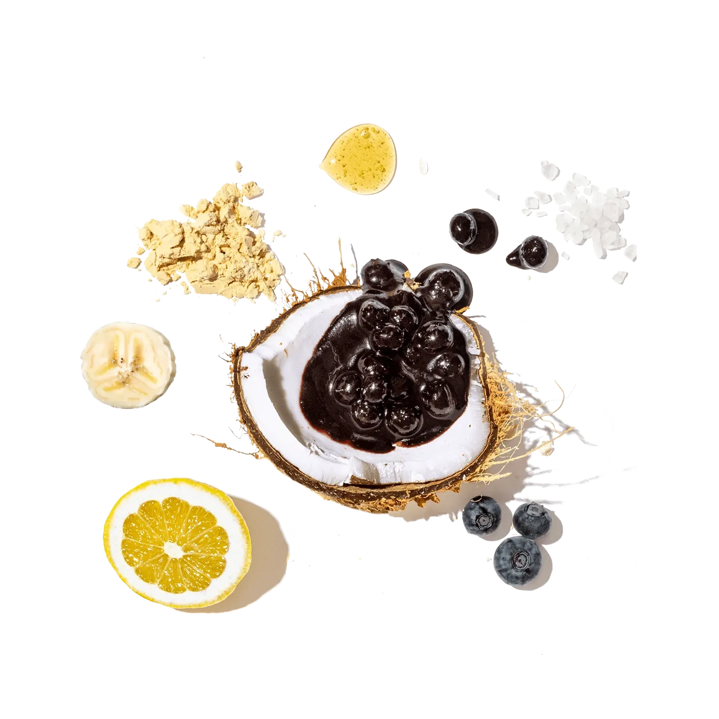 Coconut with dark chocolate and berries on a black background