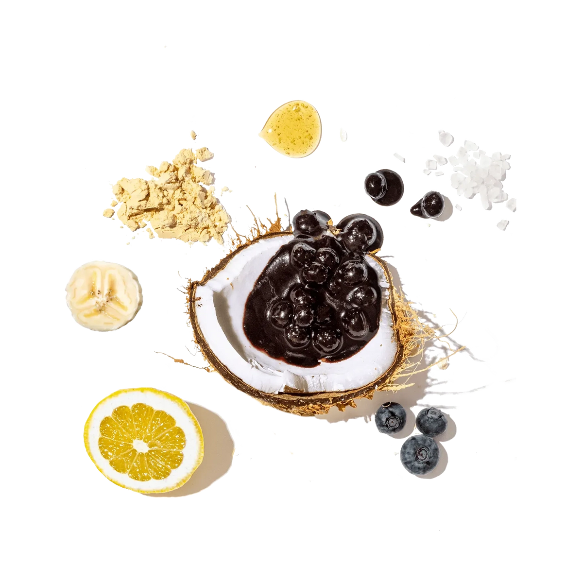 Coconut with dark chocolate and berries on a black background