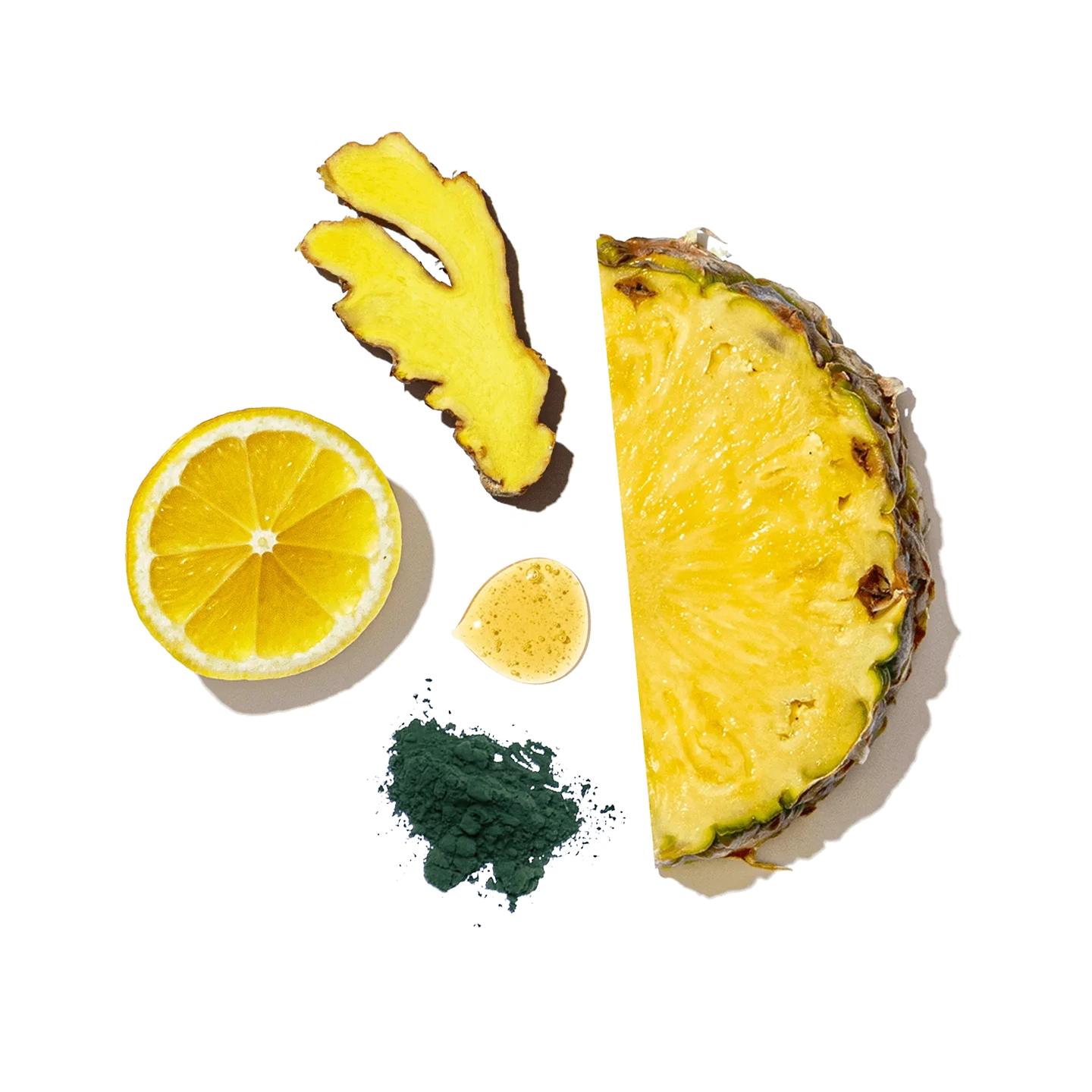 Pineapple, lemon, and spirulina on a white background