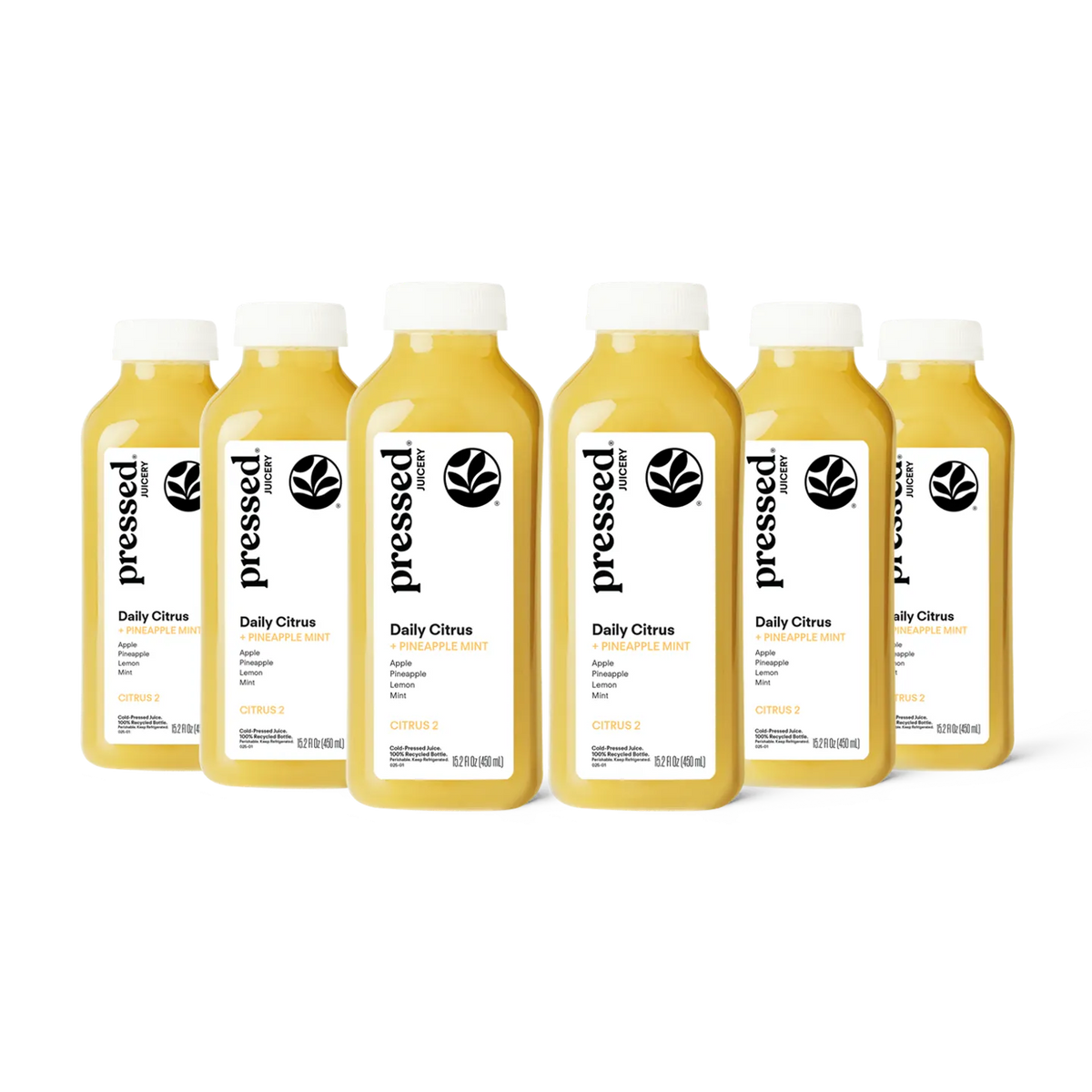 Six bottles of 'pressed' Daily Citrus juice on a white background