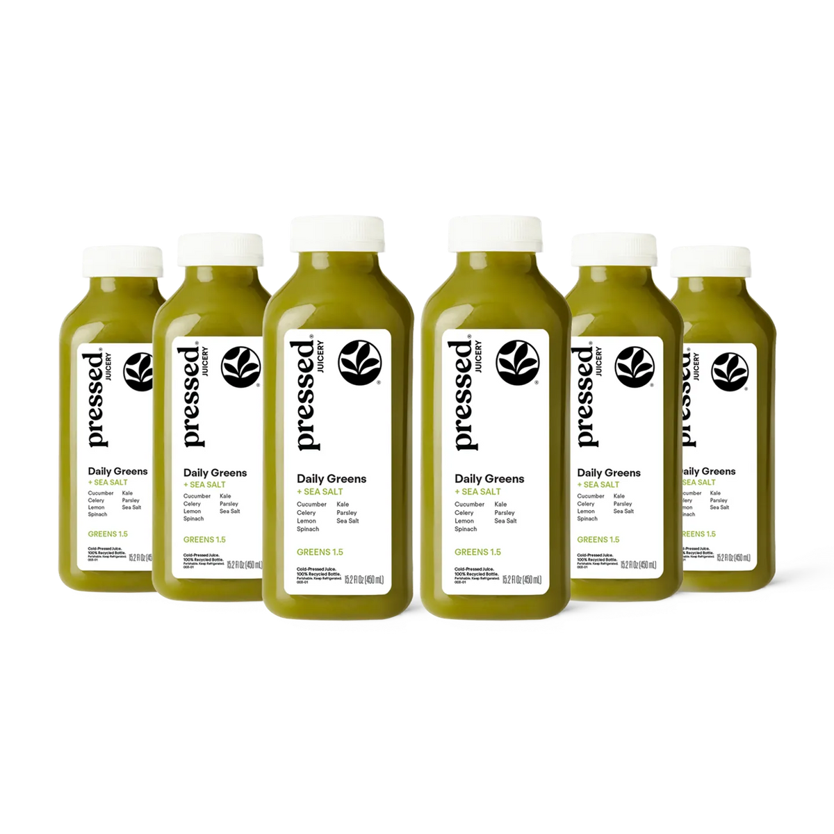 Six bottles of 'pressed' Daily Greens juice on a white background