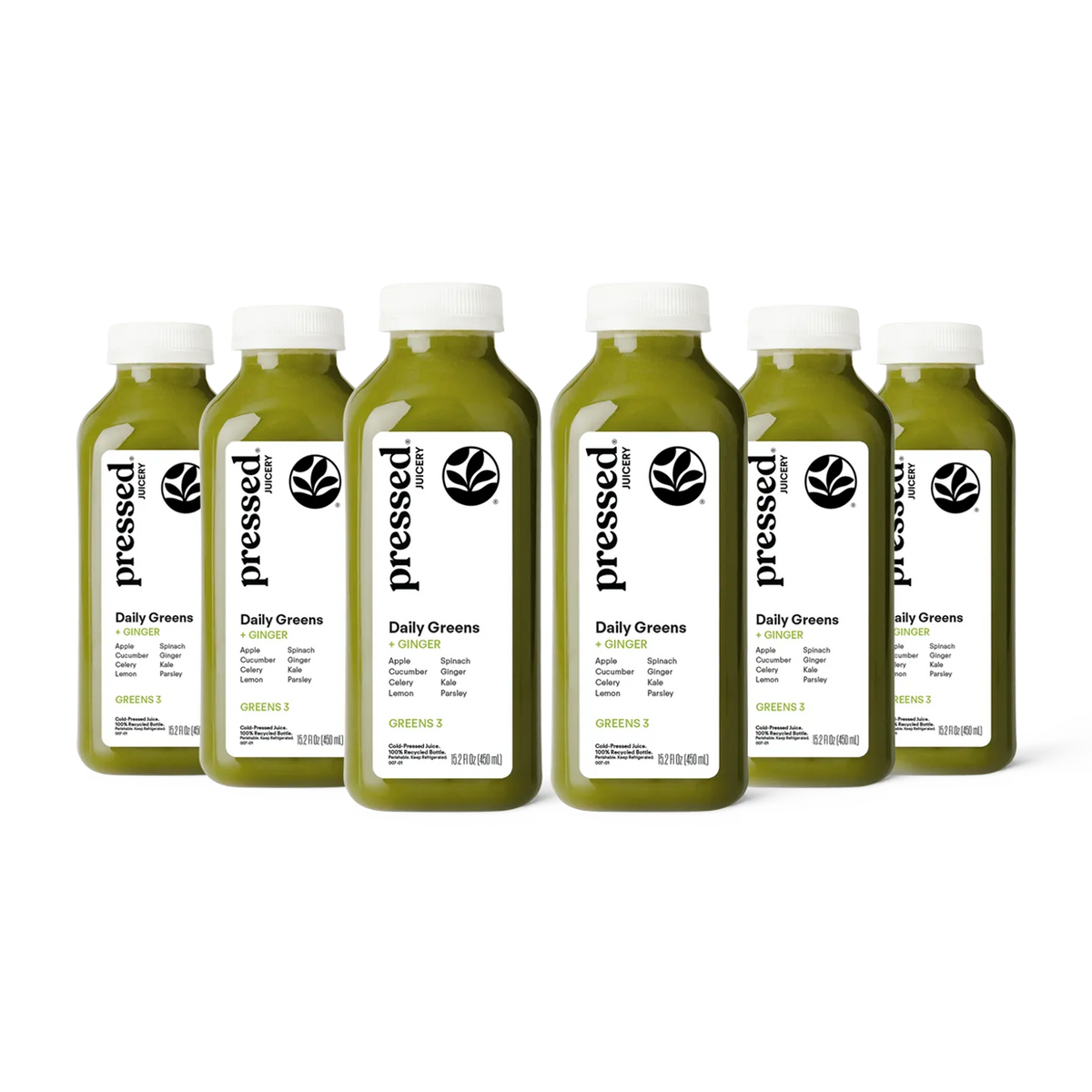 Six bottles of 'pressed' Daily Greens juice on a white background