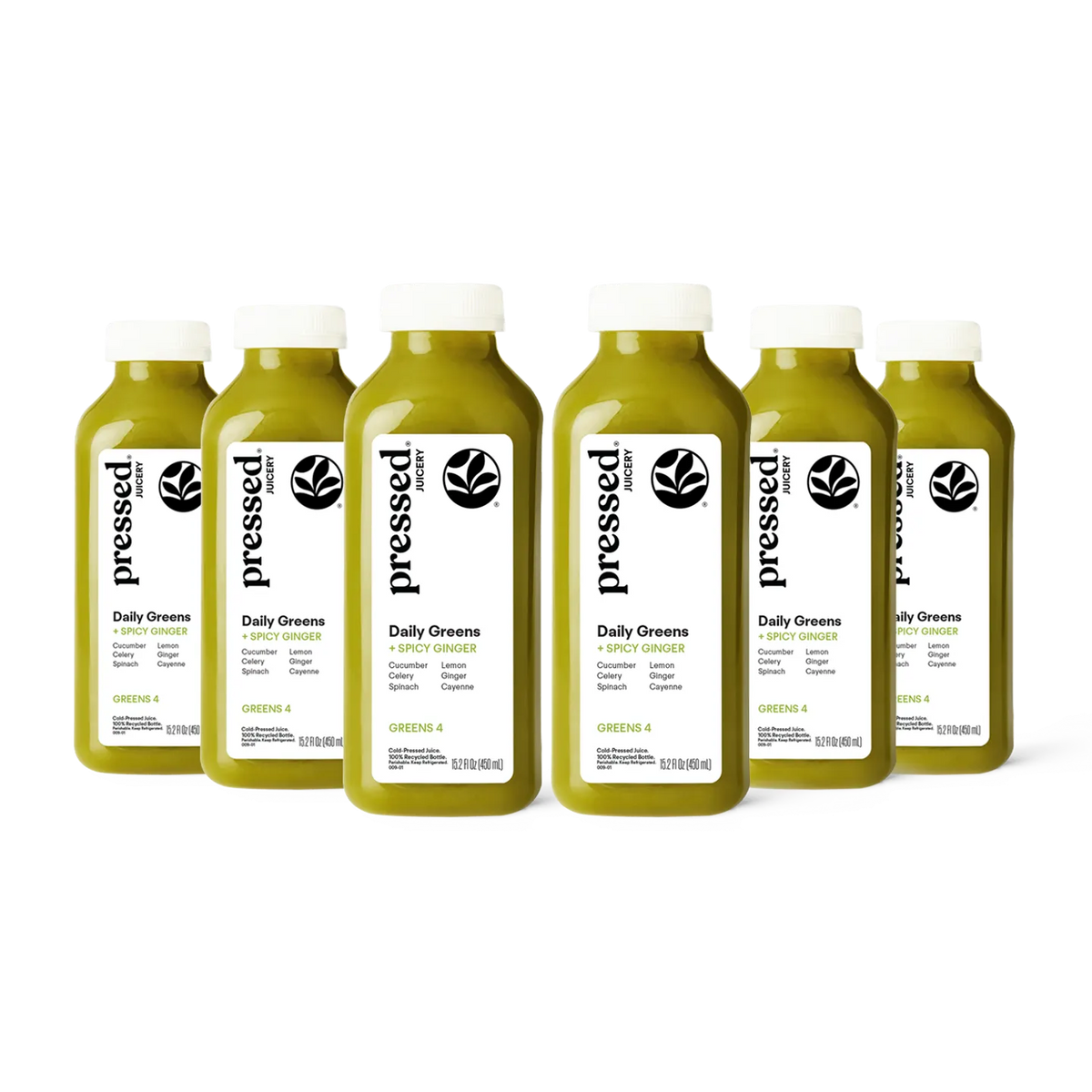 Bottles of 'pressed' Daily Greens juice on a white background