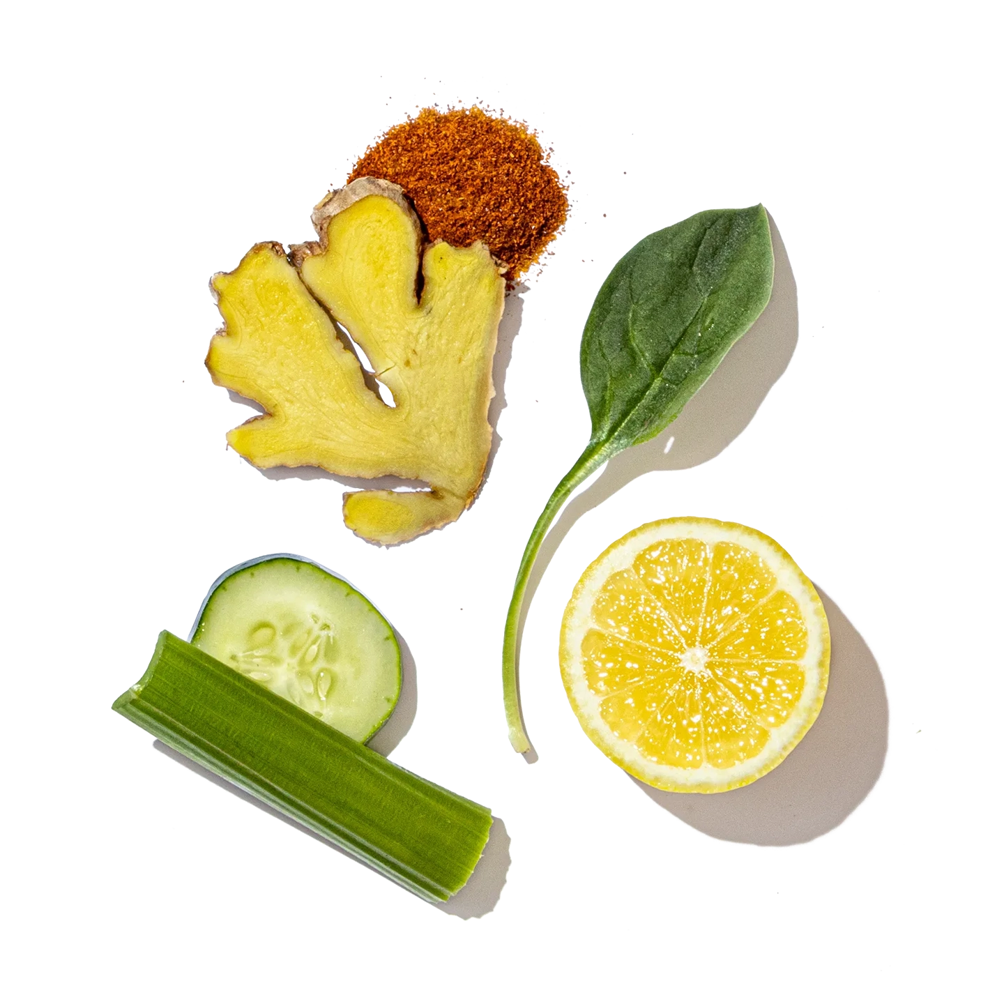 Ginger root, lemon, cucumber, and spinach on a transparent background