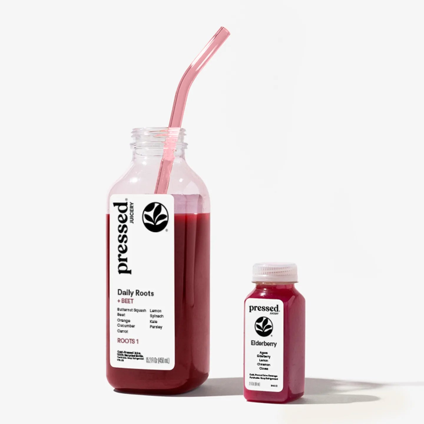 Two bottles of 'pressed' juice, one large and one small, with a straw on a white background.