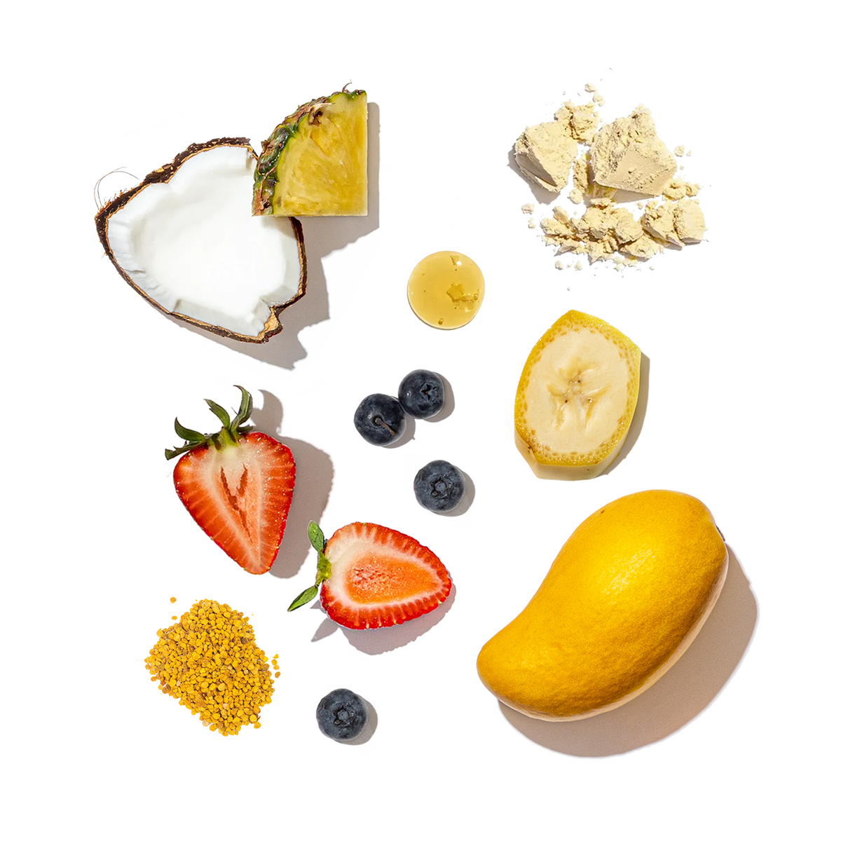 Assorted fruits like pineapple, strawberries, blueberries and bananas with mango on a transparent background.