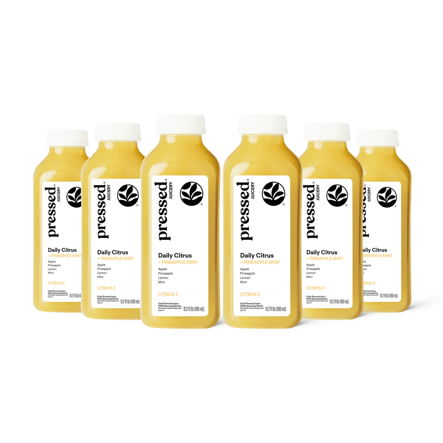 Six bottles of 'pressed' Daily Citrus juice on a white background