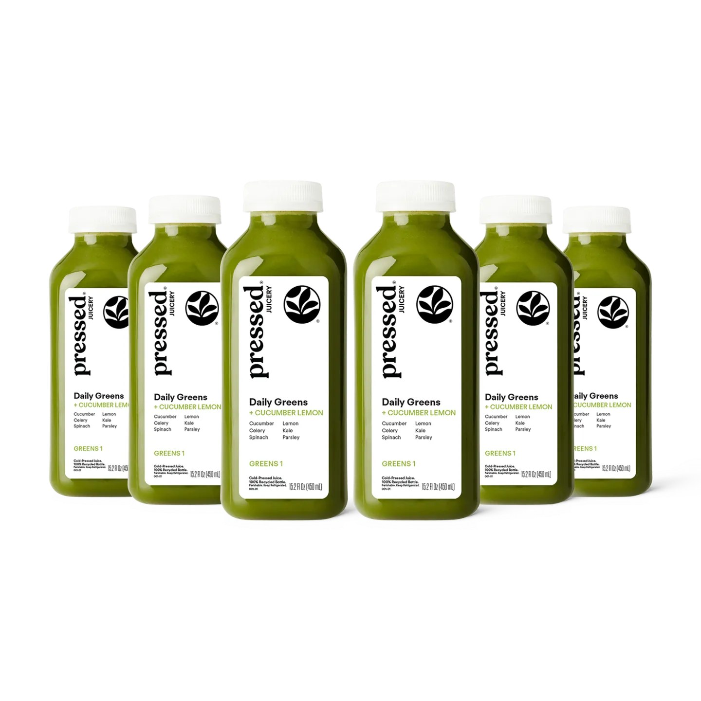 Bottles of pressed Daily Greens juice on a white background