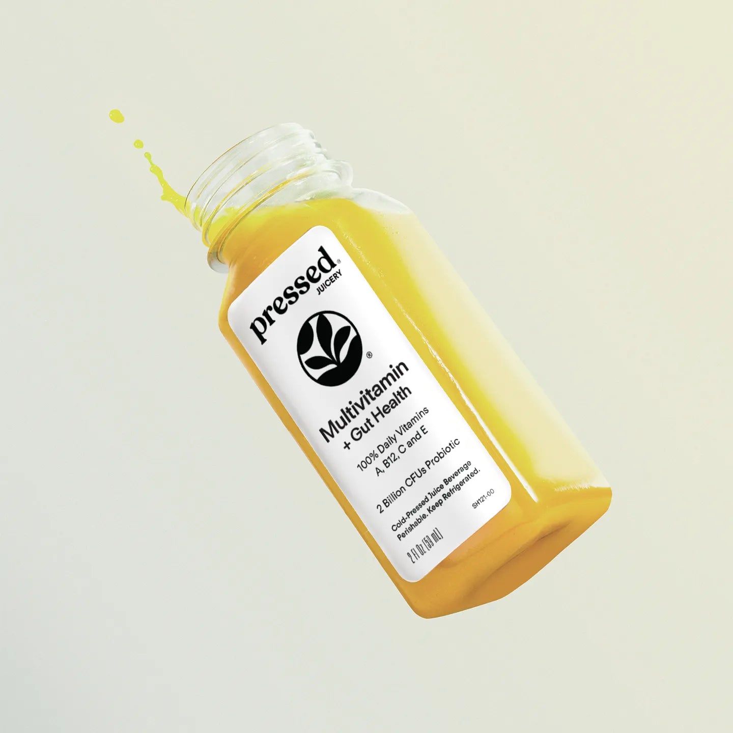 Bottle of 'pressed' multivitamin with a white label on a light gray background