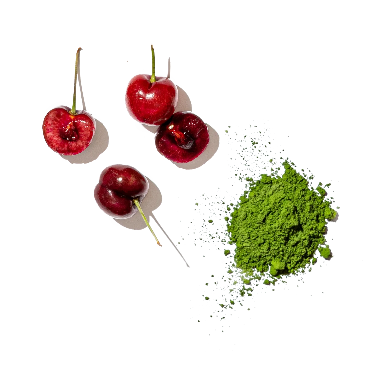 Cherries on a white background with a green leaf and small white flowers.